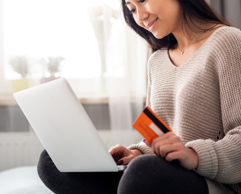 Shopper considering a purchase while browsing on a laptop